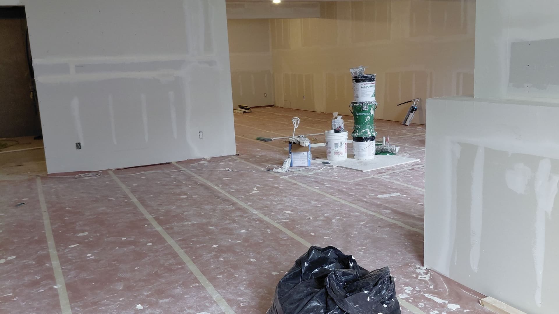Ramy Drywall LLC crew finishing a basement in the Twin Cities
